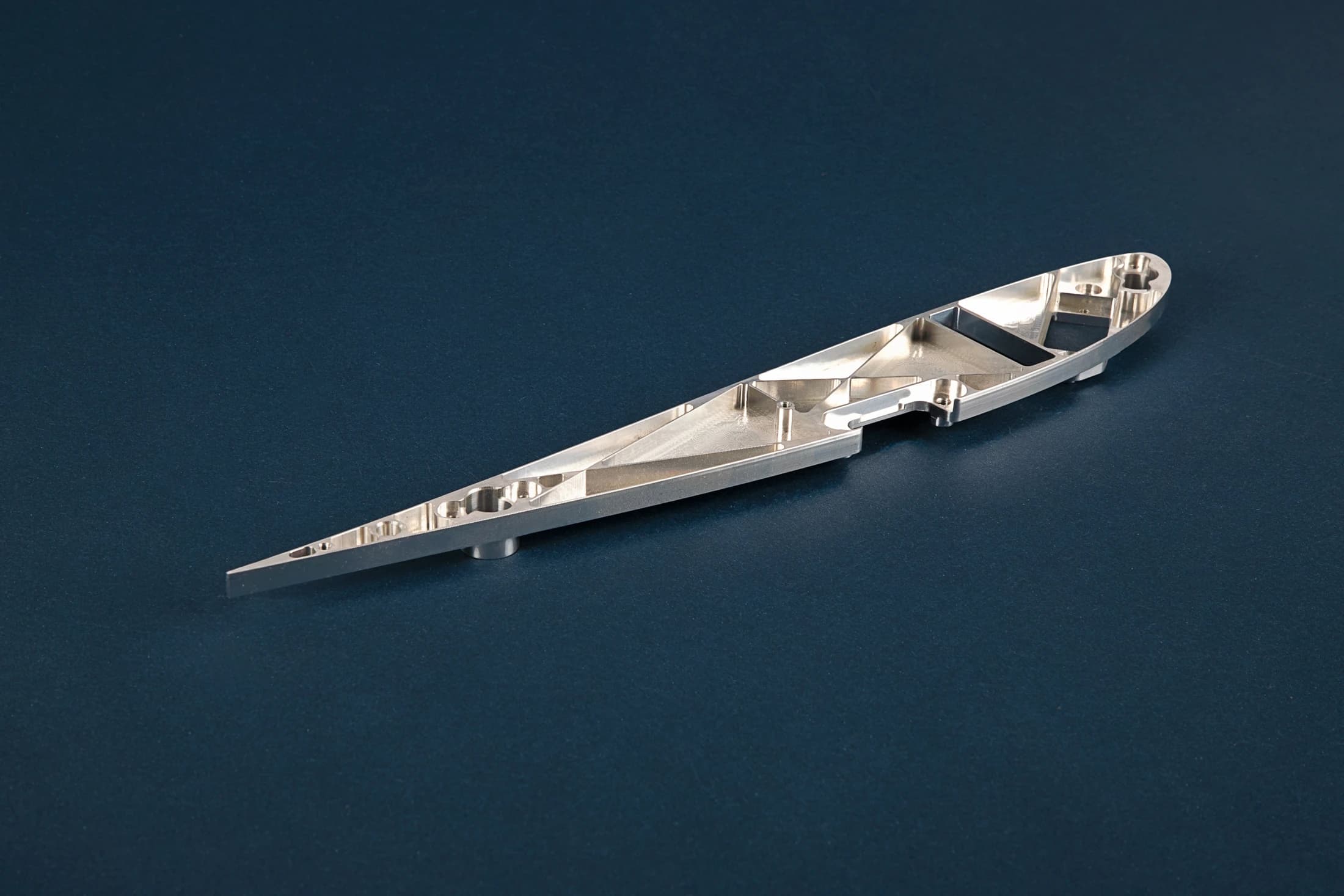 CNC Experts elongated part with machined pockets
