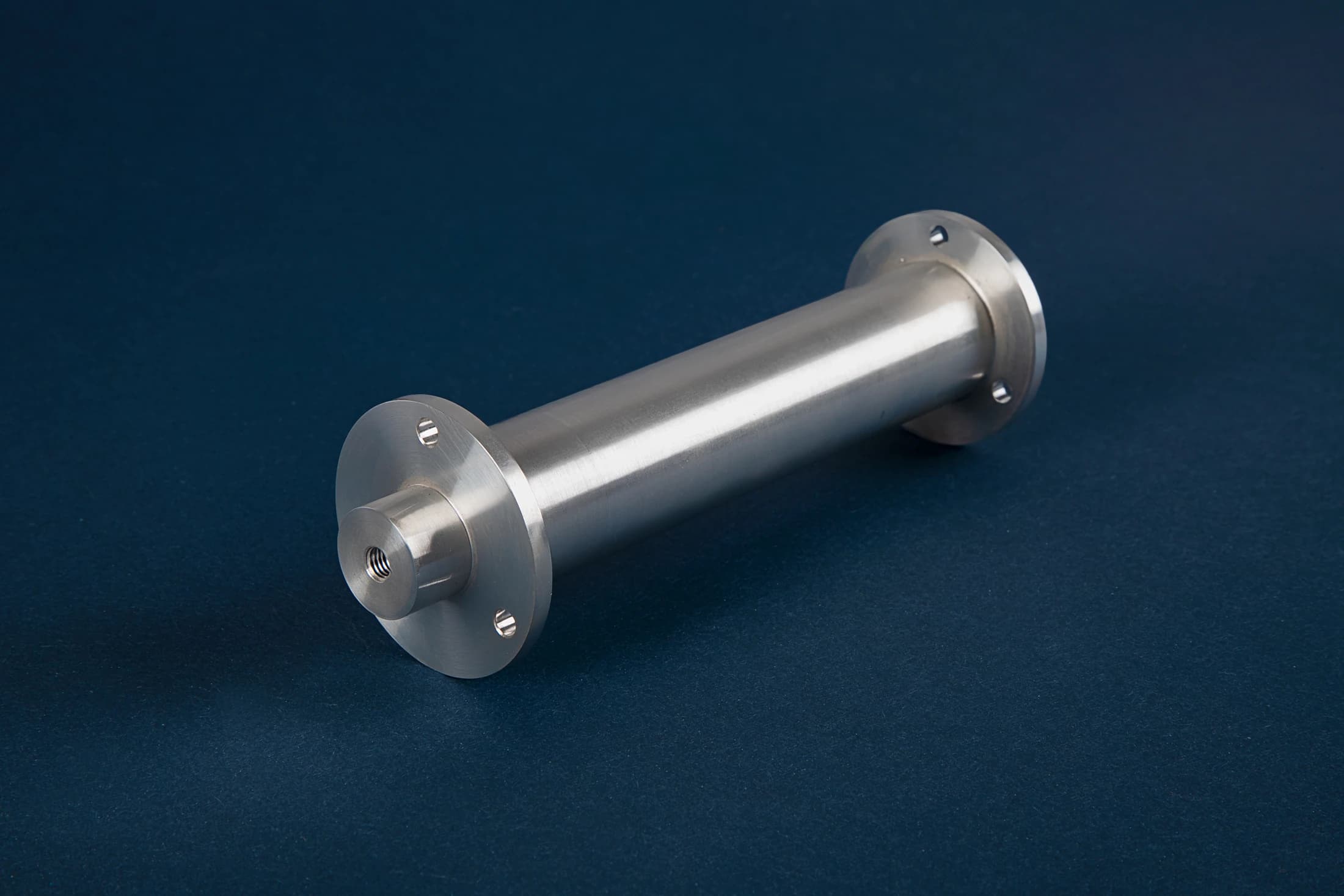 Turned part with flanges on a dark blue background