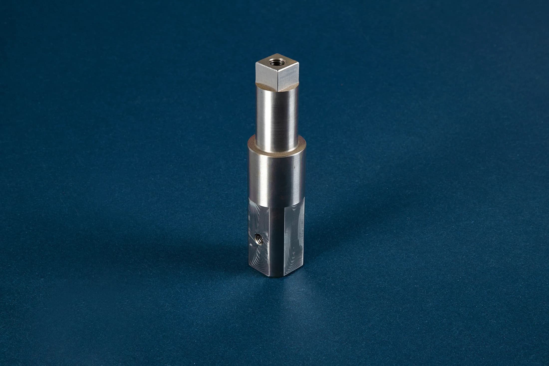 Stepped shaft part on a dark blue background