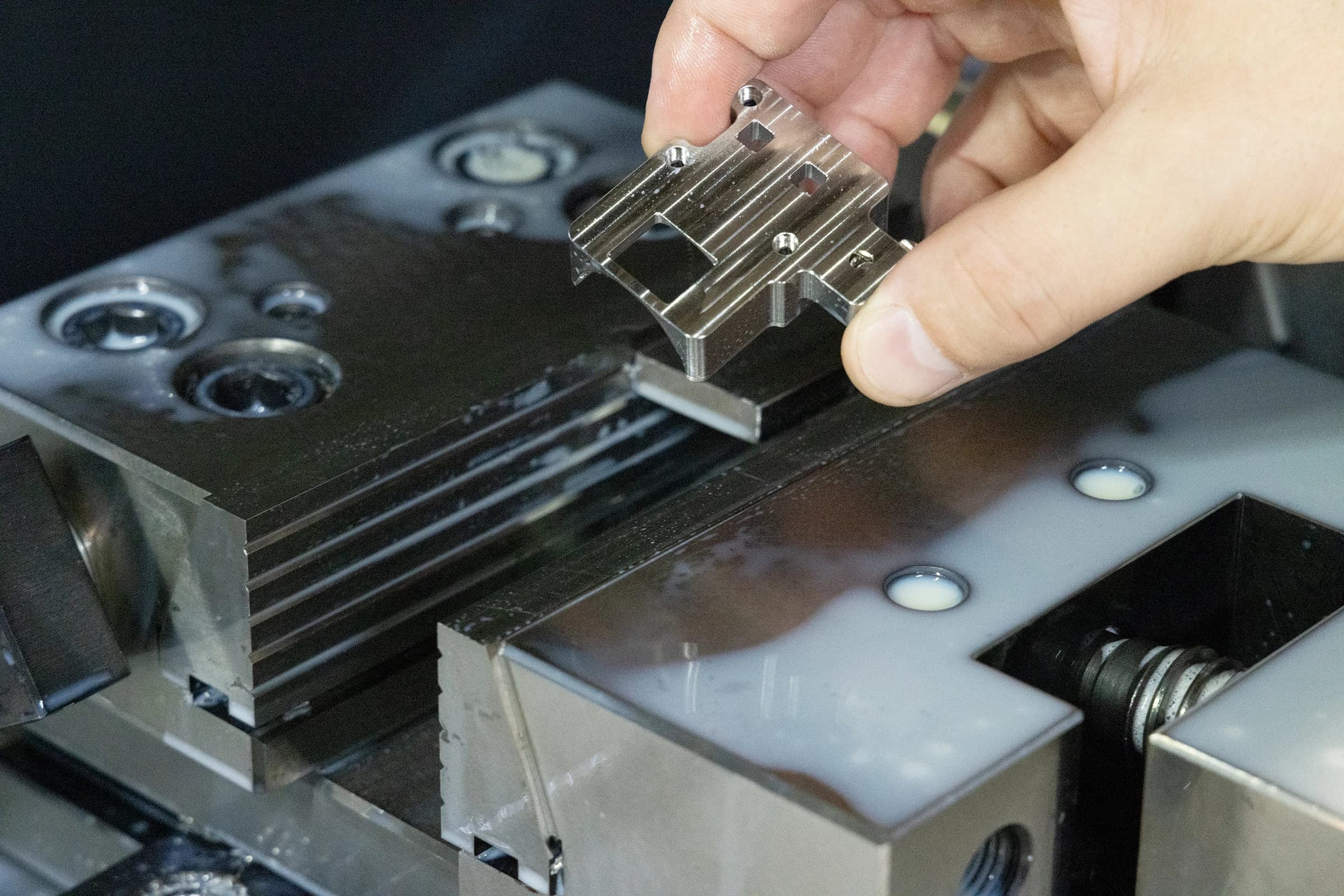 Machined part held above a machine fixture