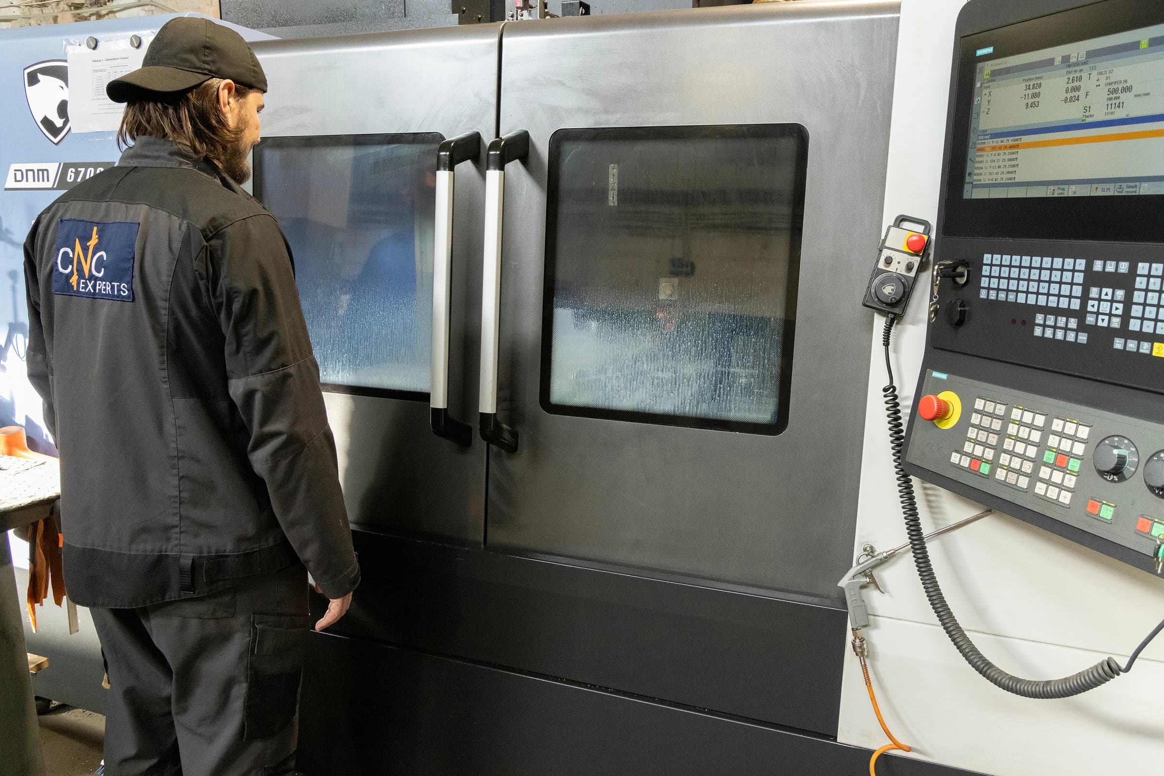 Operator at a CNC machine in the workshop